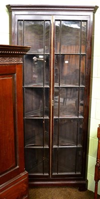 Lot 1447 - A 19th century glazed standing corner cupboard