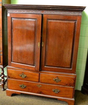 Lot 1448 - A mahogany linen press of small proportions