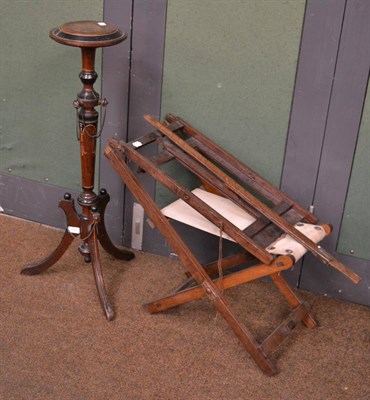 Lot 1450 - A late 19th century walnut and ebonised torchère, with circular top, raised on a turned and...