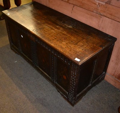 Lot 1459 - An 18th century oak four panelled coffer