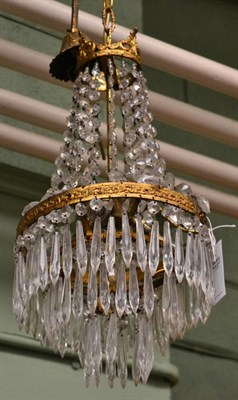 Lot 1467 - A gilt metal and cut glass drop pendant light fitting