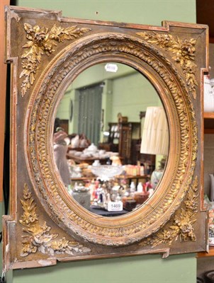 Lot 1469 - A 19th century gilt and gesso mirror with oval plate