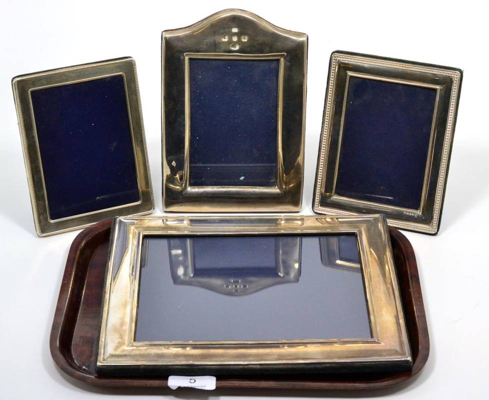 Lot 5 - Three silver photograph frames and a larger plated example (4)