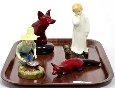 Lot 65 - Royal Doulton flambe foxes; a Royal Doulton dog and two figures (5)