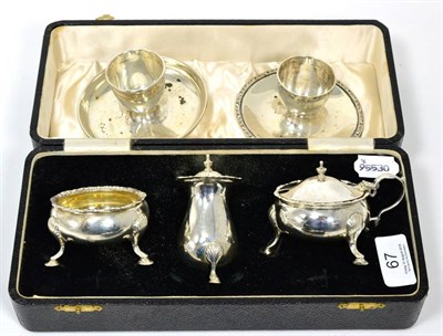 Lot 67 - A matched George III style silver three piece condiment set, Stokes & Ireland, Chester and S...