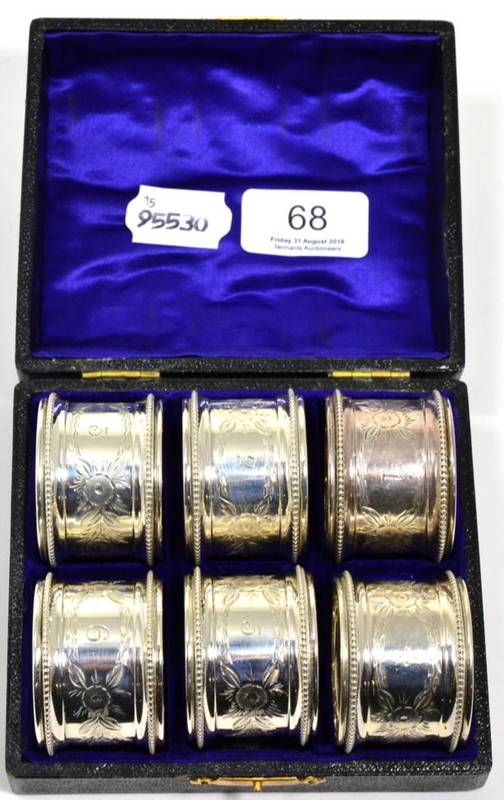 Lot 68 - A set of six silver napkin rings, Birmingham 1913, numbered 1-6 in a fitted case, 3.4ozt