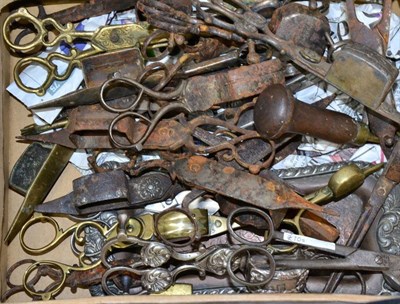Lot 70 - A collection of twenty five various, mostly 19th century, candle snuffers, assorted designs, with a