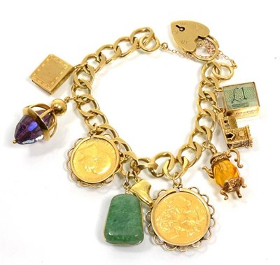 Lot 78 - A charm bracelet including a sovereign and a half sovereign