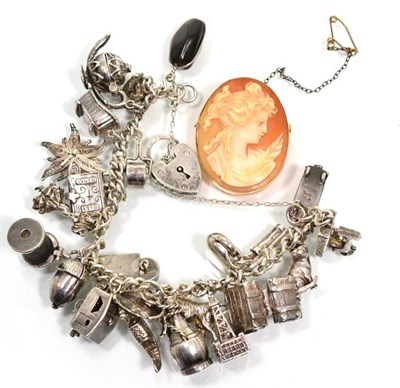 Lot 80 - A silver charm bracelet and a cameo brooch