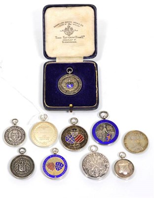 Lot 87 - A small group of silver and silver and enamelled sports and other medals
