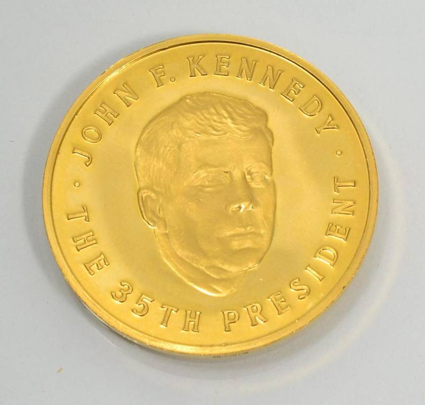 Lot 90 - An American commemorative medal for John F. Kennedy, The 35th President, stamped 0.900 (gold)
