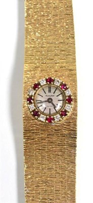Lot 96 - A lady's 9 carat gold diamond and ruby set wristwatch, signed Bueche Girod