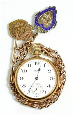 Lot 106 - A gold open faced pocket watch, on gold chain with two medals