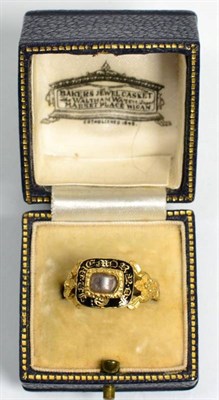 Lot 109 - An 18 carat gold mourning ring, a central glazed panel containing hairwork, within a black...