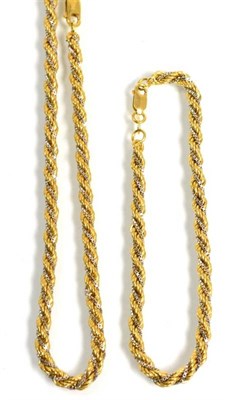 Lot 111 - A yellow and white rope chain necklace and bracelet suite, length 47cm and 20cm, stamped '750' (2)