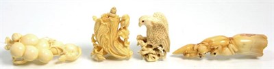 Lot 115 - Four Japanese Meiji period ivory carvings of an eagle, frogs, squirrels and fruit