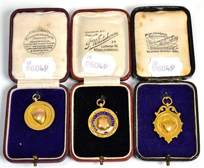 Lot 116 - A gold and enamel football medal stamped 9ct and two 9 carat gold cricket medals (3)
