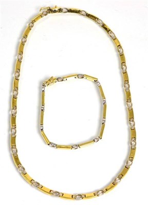 Lot 122 - A necklace and bracelet suite, of alternating brushed polished yellow bar links and bright polished