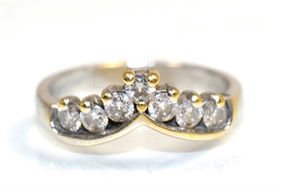 Lot 140 - A diamond wishbone ring, of seven round brilliant cut diamonds, total estimated diamond weight 0.60
