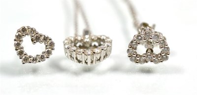 Lot 141 - An 18 carat white gold diamond heart pendant and earring suite, total estimated diamond weight 0.40