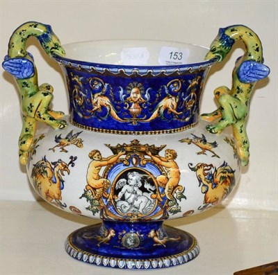 Lot 153 - A 19th century French tin glazed twin dragon handled vase