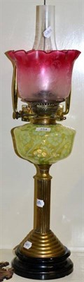 Lot 154 - A Victorian oil lamp, with cranberry tinted shade