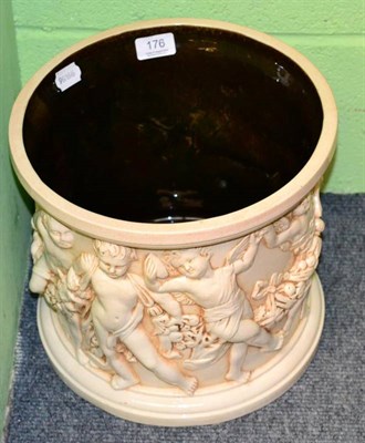 Lot 176 - A large Bretby jardiniere decorated with putti