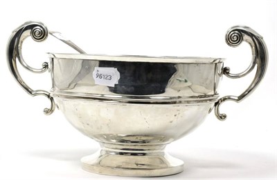 Lot 198 - A Walker & Hall silver twin handle punch bowl, together with a silver soup ladle, 41.28ozt gross