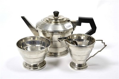 Lot 218 - A George V silver three piece tea service and two pairs of sugar tongs, 21.5ozt