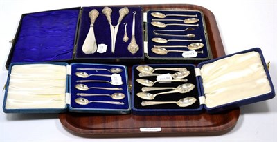 Lot 227 - A cased set of six silver seal top teaspoons with matching tongs, two cased sets of six silver...