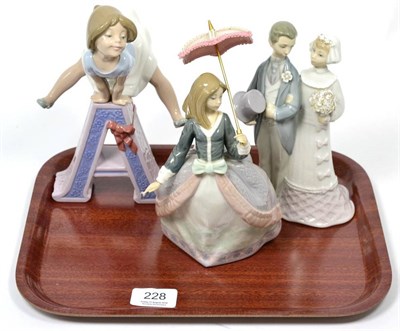 Lot 228 - Three Lladro china figures: girl with parasol, wedding couple and girl leapfrogging over the letter