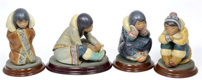 Lot 239 - Four Lladro Eskimo figures (one damaged)