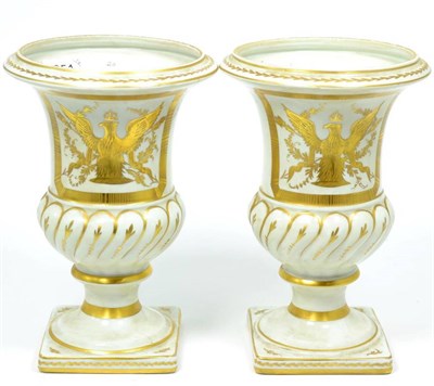 Lot 251 - A pair of 20th century Limoges porcelain urn shaped vases gilt decorated in the Napoleonic...