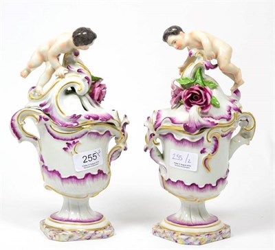 Lot 255 - A pair of Frankenthal porcelain covered ewers