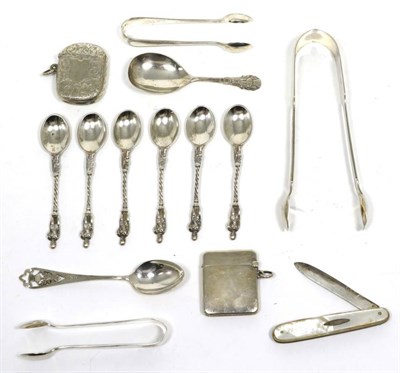 Lot 280 - A group of silver comprising two vestas, three sets of tongs, a set of six apostle spoons, an...