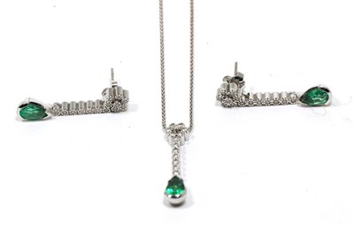 Lot 301 - An emerald necklace and earring suite, a cluster of round brilliant cut diamonds suspends a diamond