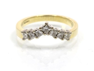 Lot 303 - An 18 carat gold diamond wishbone ring, of seven princess cut diamonds, total estimated diamond...