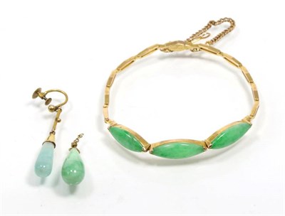 Lot 322 - A jade bracelet, three marquise cabochon jade, to a split bar link bracelet, length 18cm, with...