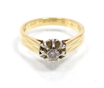 Lot 324 - An 18 carat gold solitaire diamond ring, a round brilliant cut diamond in an extended claw setting