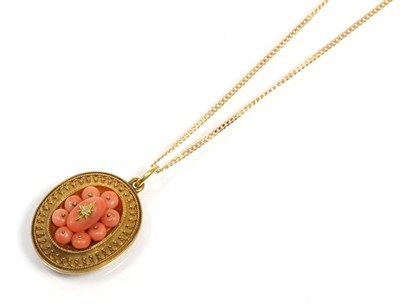 Lot 329 - A Victorain coral pendant, a central coral cluster with a star set rose cut diamond within an...