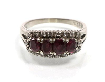 Lot 332 - A ruby and diamond ring, four graduated oval cut rubies within a border of eight-cut diamonds,...