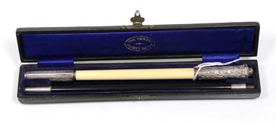 Lot 339 - 'The Handy Pocket Baton' a silver ebony and ivory two-piece conductor's baton, inscribed 'Presented