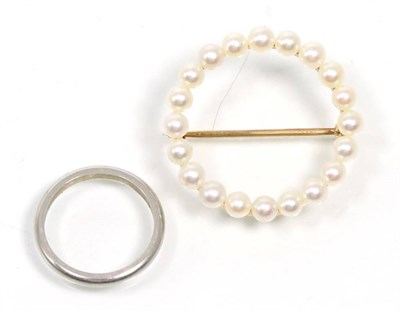 Lot 344 - A band ring, finger size K, stamped '10% IRID PLAT' and a cultured pearl hoop brooch, stamped '14K'