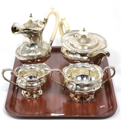 Lot 365 - A four-piece silver and ivory handled teaset, by Walker & Hall, Sheffield, 1938/39, comprising...