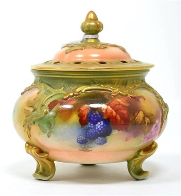 Lot 371 - A Royal Worcester vase with pierced lid on three scrolled feet