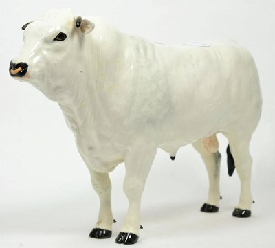 Lot 375 - A Shebeg Isle of Man pottery standing bull, (possibly White Park) signed D Thomson