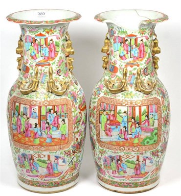 Lot 389 - A large pair of Chinese Canton porcelain famille rose vases, (both with damages) 47cm high