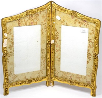 Lot 391 - A gilt, gesso framed, silk work, two fold table frame