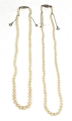 Lot 405 - Two early twentieth century cultured pearl necklaces, each with graduated cultured pearls...