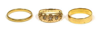 Lot 415 - An 18 carat gold diamond ring, three star set old cut diamonds, to a carved setting, finger...